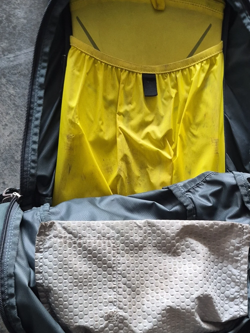 OSPREY Teal Backpack with Yellow Accents and Gray Pockets